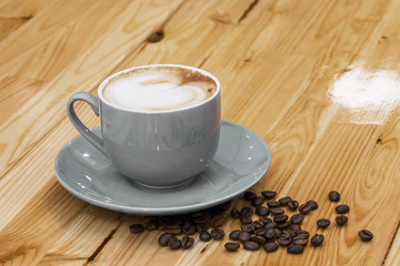 Cup of coffee with grains