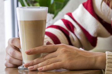 Girl having glass of coffee