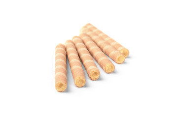 Sweet chocolate waffle rolls isolated on white background.