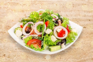 Fresh tasty vegetable salad in bowl on white background