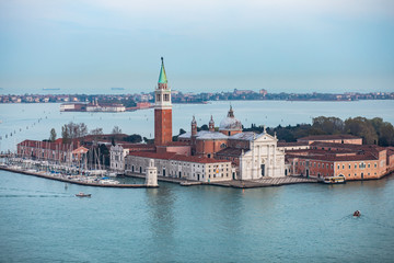 Obraz premium Beautiful super wide-angle aerial view of Venice, Italy with harbor, islands, skyline and scenery beyond the city, seen from the observation tower of St Mark's Campanile