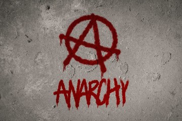 Anarchy symbol spray painted on the wall