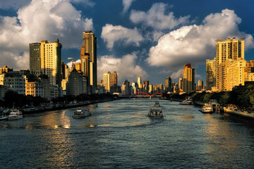 Pearl (Zhujiang) River at sunset and Guangzhou city skyline.    