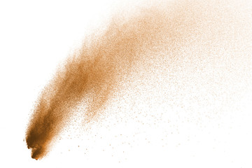 Explosion of brown powder on white background.