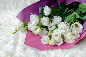 eustoma flowers in a beautiful bouquet on a light background