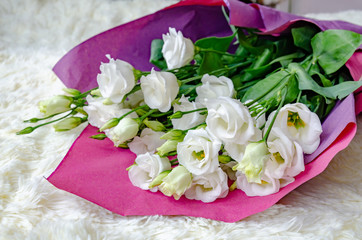eustoma flowers in a beautiful bouquet on a light background