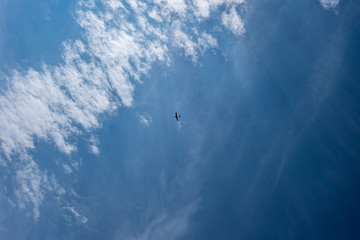 Fototapeta na wymiar blue sky with clouds and plane trails