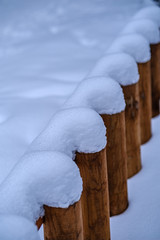simple country fence under snow in winter