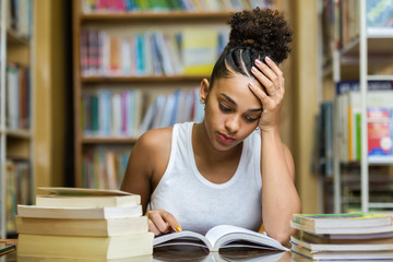 Black african american young girl student studying at the school university library