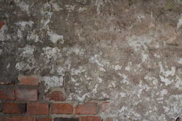 Old brick wall cover with concrete