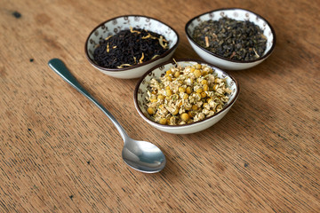 Earl Grey and Chamomile tea on a wooden table 