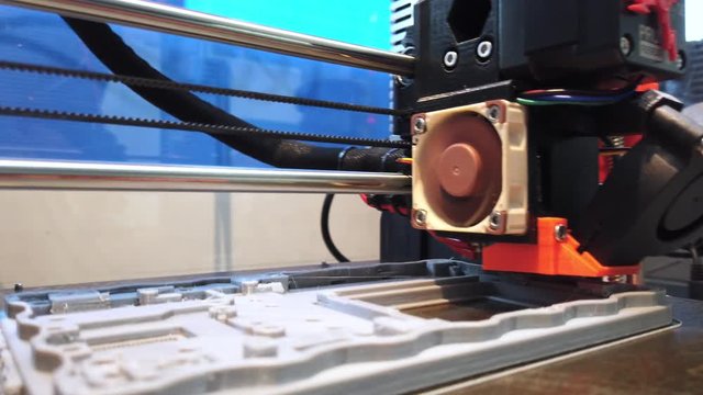 Automatic three dimensional 3d printer performs product creation. Modern 3D printing can halp to make prototype..