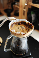 Unusual creative coconut shell pourover alternative coffee brewing drip water with gooseneck kettle