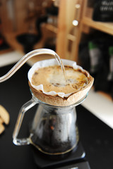 Unusual creative coconut shell pourover alternative coffee brewing drip water with gooseneck kettle