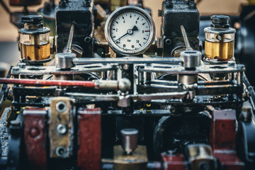 Fototapeta na wymiar Close-up photo of an old machine with pressure meter
