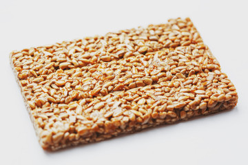Healthy snacks. Fitness diet food. Kozinaki fritter, seeds, energy bars. White background top view. Isolate, Copy Space