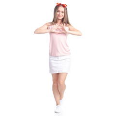 Obraz na płótnie Canvas Woman in skirt with sunglasses standing smiling happiness showing heart on white background isolation