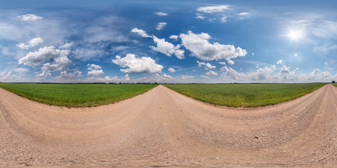 full seamless spherical hdri panorama 360 degrees angle view on gravel road among fields in summer...