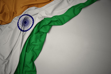 waving national flag of india on a gray background.