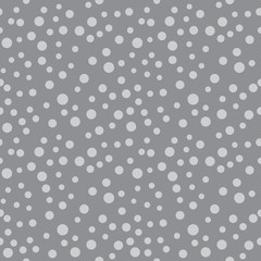 Seamless polka dot pattern. Geometric vector background in grey. Spot of different sizes placed randomly. Useful for fabric print, interior decorating, home textiles, cloth, wrapping paper, apparel