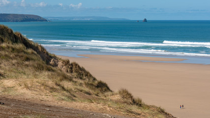 Surf on a sandy beach in Cornwall England