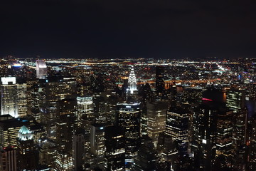 vista nocturna de ciudad de nueva york - obrazy, fototapety, plakaty