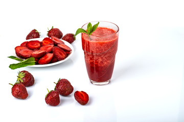 Glass of strawberry smoothie on white background