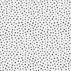 Randomly placed polka dots, hand drawn spots seamless vector pattern. Scattered big and small circles, points in various sizes. Monochrome retro background. Decorative black and white design tiles.