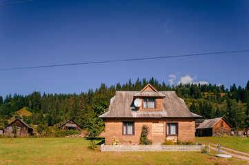 Fototapeta na wymiar Old fashioned vintage wooden house in the mountains.