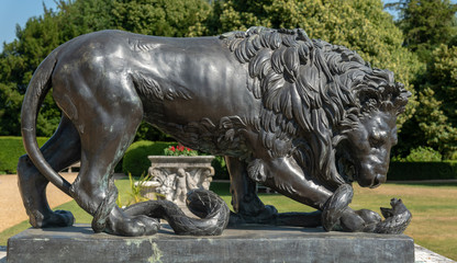 Statue of lion overpowering a snake