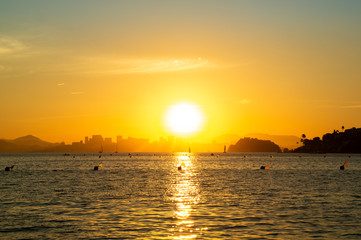 Sunset at the beach with reflection in the sea