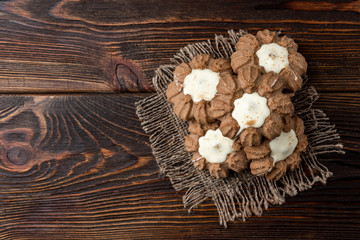 Obraz na płótnie Canvas Chocolate shortbread cookies on dark wooden background.