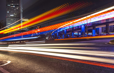 Fototapeta na wymiar Traffic in the city at night, light trail of car.