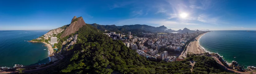 Poster Sunrise 360 degree full panoramic aerial view of Two Brothers mountain and Leblon beach and neighbourhood in Rio de Janeiro in the foreground and the wider cityscape in the background © Maarten Zeehandelaar