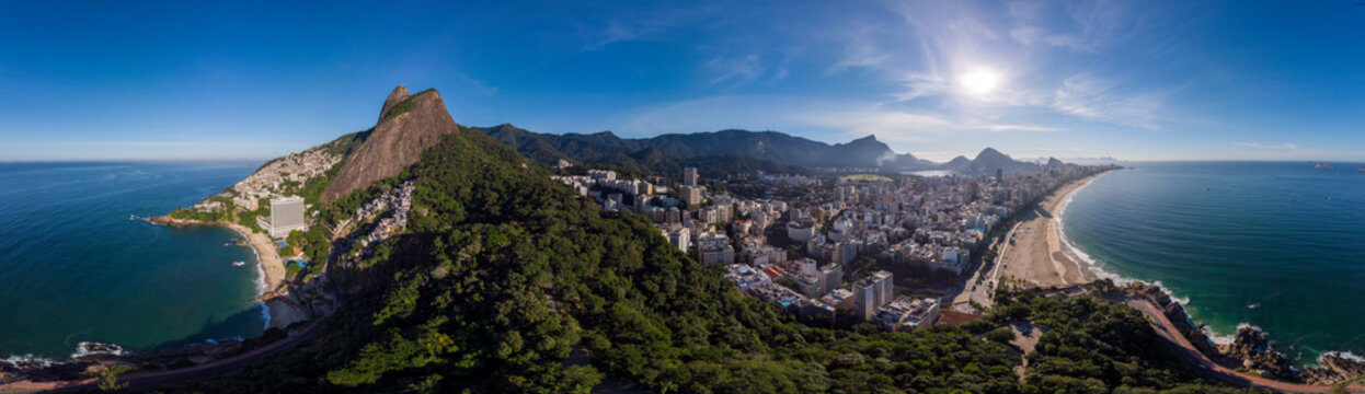 Sunrise 360 degree full panoramic aerial view of Two Brothers mountain and Leblon beach and neighbourhood in Rio de Janeiro in the foreground and the wider cityscape in the background