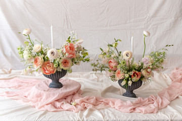 Still life with  beautiful bouquets of flowers and candles