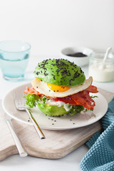 keto paleo diet avocado breakfast burger with bacon, egg, tomato