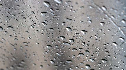 Drops of condensate on the surface of a plastic bottle, close-up
