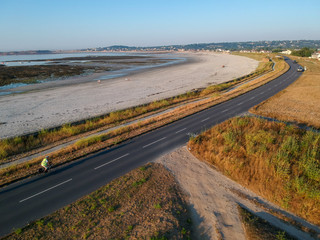 Aerial view of road next to the beach. South coast of Guernsey island, UK, Europe.