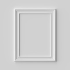 White vertical picture or photo frame on white wall with shadows