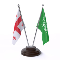 Georgia and Saudi Arabia, two table flags isolated on white background. 3d image