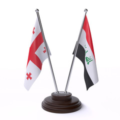 Georgia and Iraq, two table flags isolated on white background. 3d image