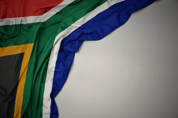 Fotobehang Afrika waving national flag of south africa on a gray background.  © luzitanija