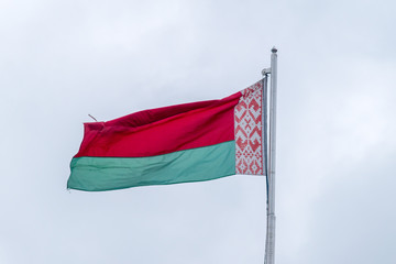 Fototapeta na wymiar National flag of Belarus on a flagpole.