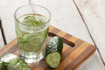 Cucumber water, cleansing water to detoxify the body and quench thirst on a white background.