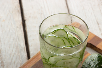 Cucumber water, cleansing water to detoxify the body and quench thirst on a white background.