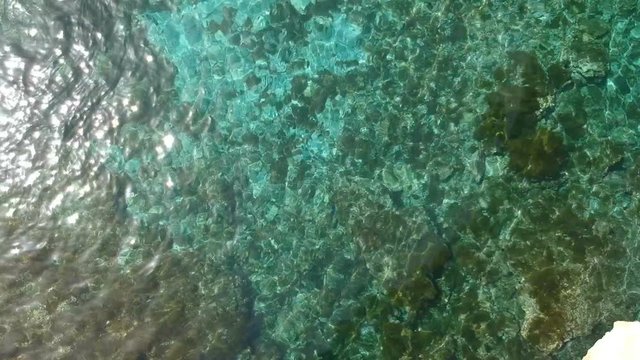 Holiday in Apulia. Drone footage of the Cave of Poetry (Grotta della Poesia). People around the natural pool, Roca vecchia - Apulia. Italy