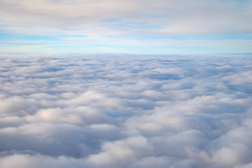 View over the clouds from airplane