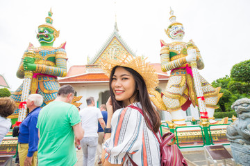 Fototapeta premium Asian backpack tourost women travel in temple of buddism