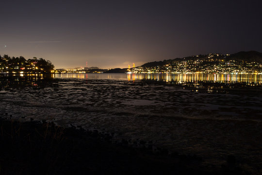 A peaceful quiet night walk in scenic Tiburon California overlooking a marsh and night light reflections of homes in Tiburon, Marin and San Francisco.